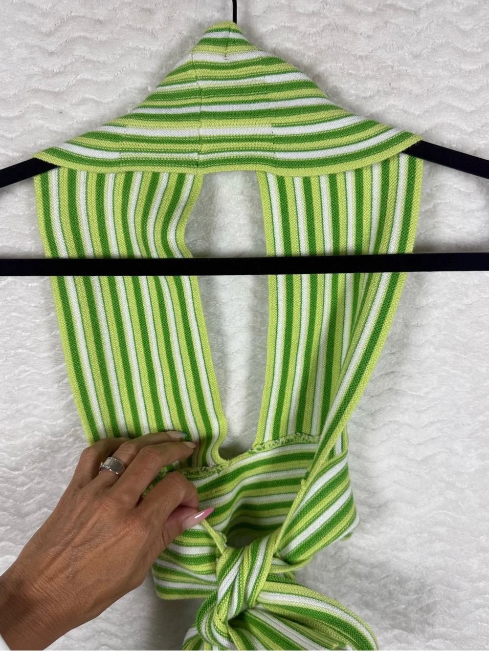 Cider striped halter top features a distinctive tie-back design vibrant green